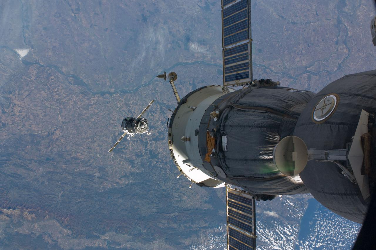 ISS017-E-019550 (14 Oct. 2008) --- The Soyuz TMA-13 spacecraft approaches the International Space Station, carrying NASA astronaut Michael Fincke, Expedition 18 commander; Russian Federal Space Agency cosmonaut Yury Lonchakov, Soyuz commander and flight engineer; and American spaceflight participant Richard Garriott. Fincke and Lonchakov will spend six months on the station, while Garriott will return to Earth on Oct. 23 with two of the Expedition 17 crewmembers currently on the complex. Northeastern Bulgaria, south of the Danube River (along the top) and north of the Balkan Mountains (along bottom), and the western Black Sea (lower right) form the backdrop for the scene.