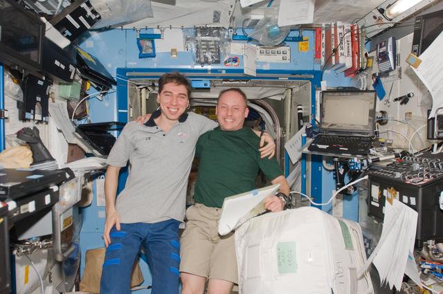 NASA image: Volkov and Finke in the  U.S. Laboratory during Joint Operations