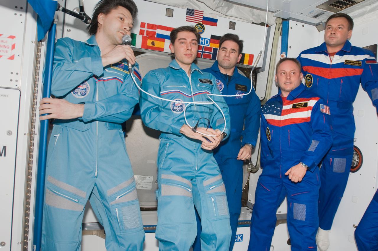 ISS017-E-021351 (22 Oct. 2008) --- Crewmembers aboard the International Space Station are photographed during the ceremony of Changing-of-Command from Expedition 17 to Expedition 18 in the Harmony node. From the left are cosmonauts Oleg Kononenko and Sergei Volkov, Expedition 17 flight engineer and commander, respectively; astronaut Greg Chamitoff, Expedition 18 flight engineer; astronaut Michael Fincke and cosmonaut Yury Lonchakov, Expedition 18 commander and flight engineer, respectively.