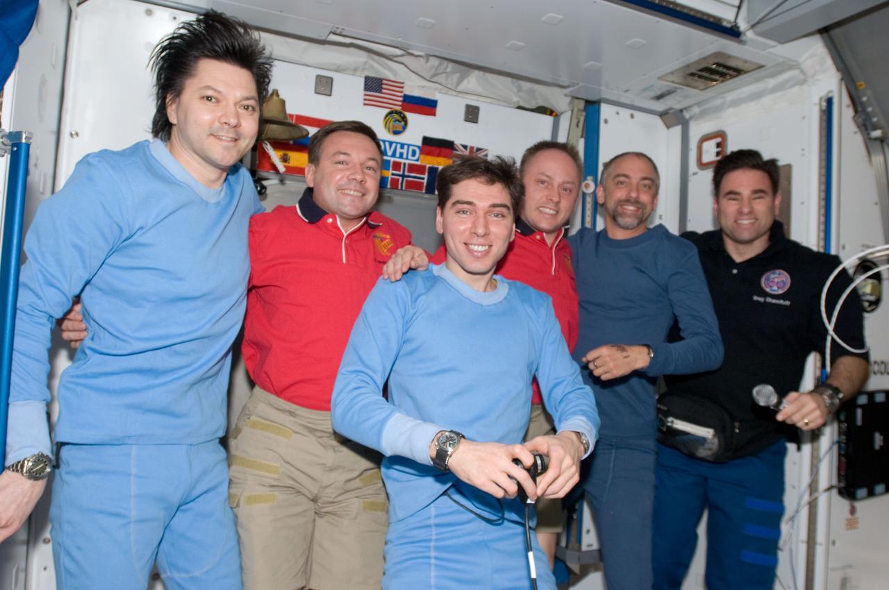 ISS017-E-021368 (23 Oct. 2008) --- Pictured from left to right, cosmonauts Oleg Kononenko, Expedition 17 flight engineer; Yury Lonchakov, Expedition 18 flight engineer; Sergei Volkov, Expedition 17 commander; astronaut Michael Fincke, Expedition 18 commander; American spaceflight participant Richard Garriott; and astronaut Greg Chamitoff, Expedition 18 flight engineer, take a moment for a group photo in the Harmony node of the International Space Station as final preparations are being made for the departure of Volkov, Kononenko and Garriott in the Soyuz TMA-12 spacecraft.