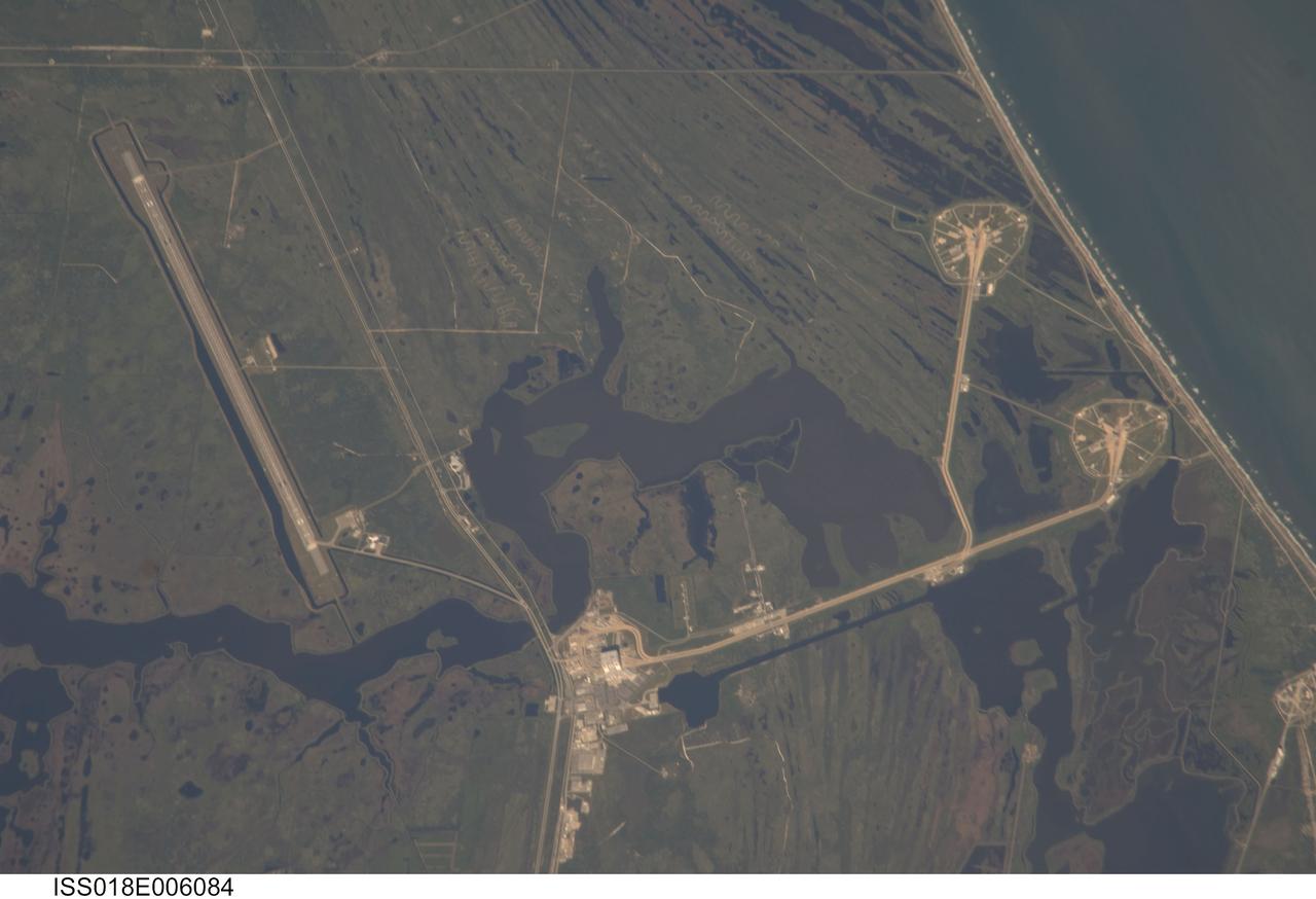 ISS018-E-006084 (29 Oct. 2008) --- Kennedy Space Center and Cape Canaveral, Florida are featured in this image photographed by an Expedition 18 crewmember on the International Space Station. Launch complex 39, with pads A and B, is visible at right. The Vehicle Assembly Building (VAB) is visible at bottom center. The Shuttle Landing Facility appears as a long thin strip at left.