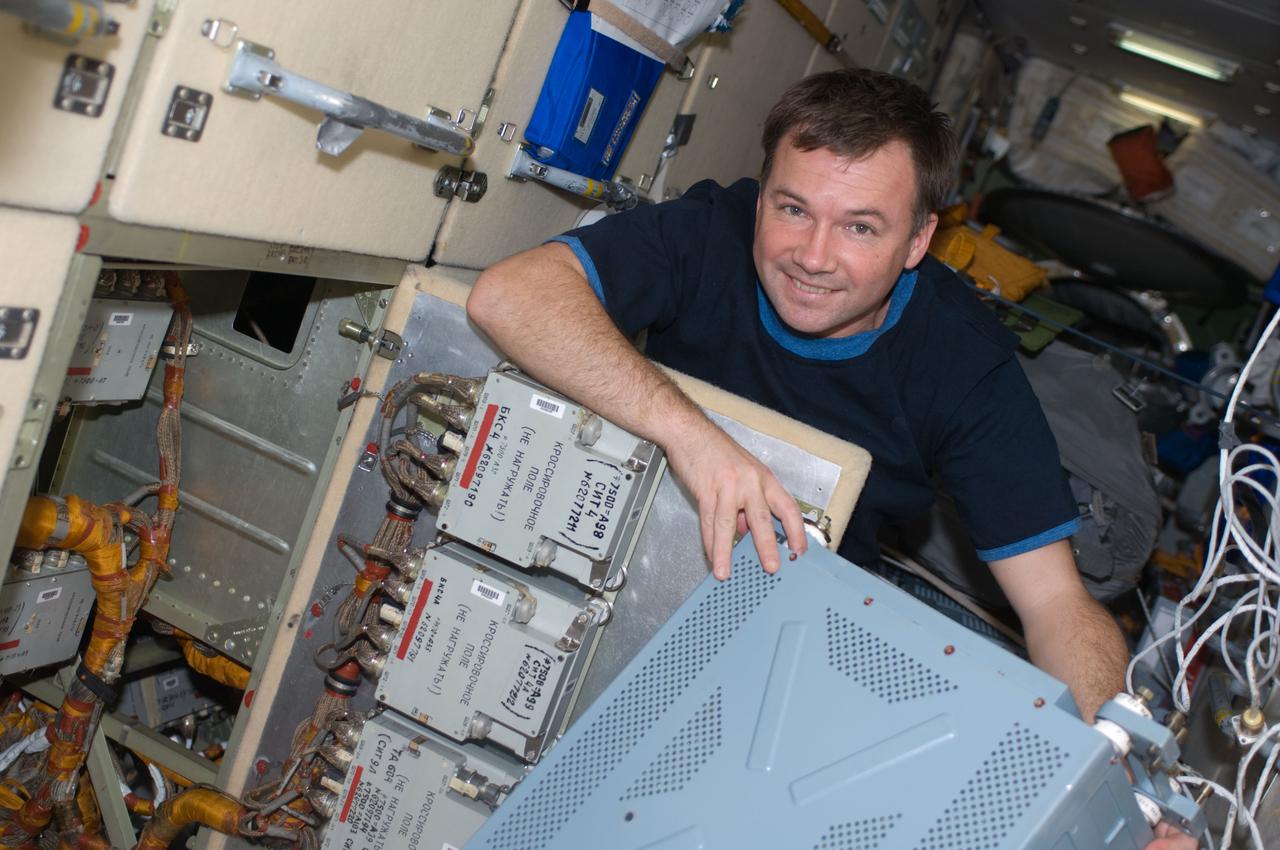 ISS018-E-007623 (5 Nov. 2008) --- Cosmonaut Yury Lonchakov, Expedition 18 flight engineer, takes a moment for a photo while performing in-flight maintenance on the Komparus A3 System in the Zarya module of the International Space Station.