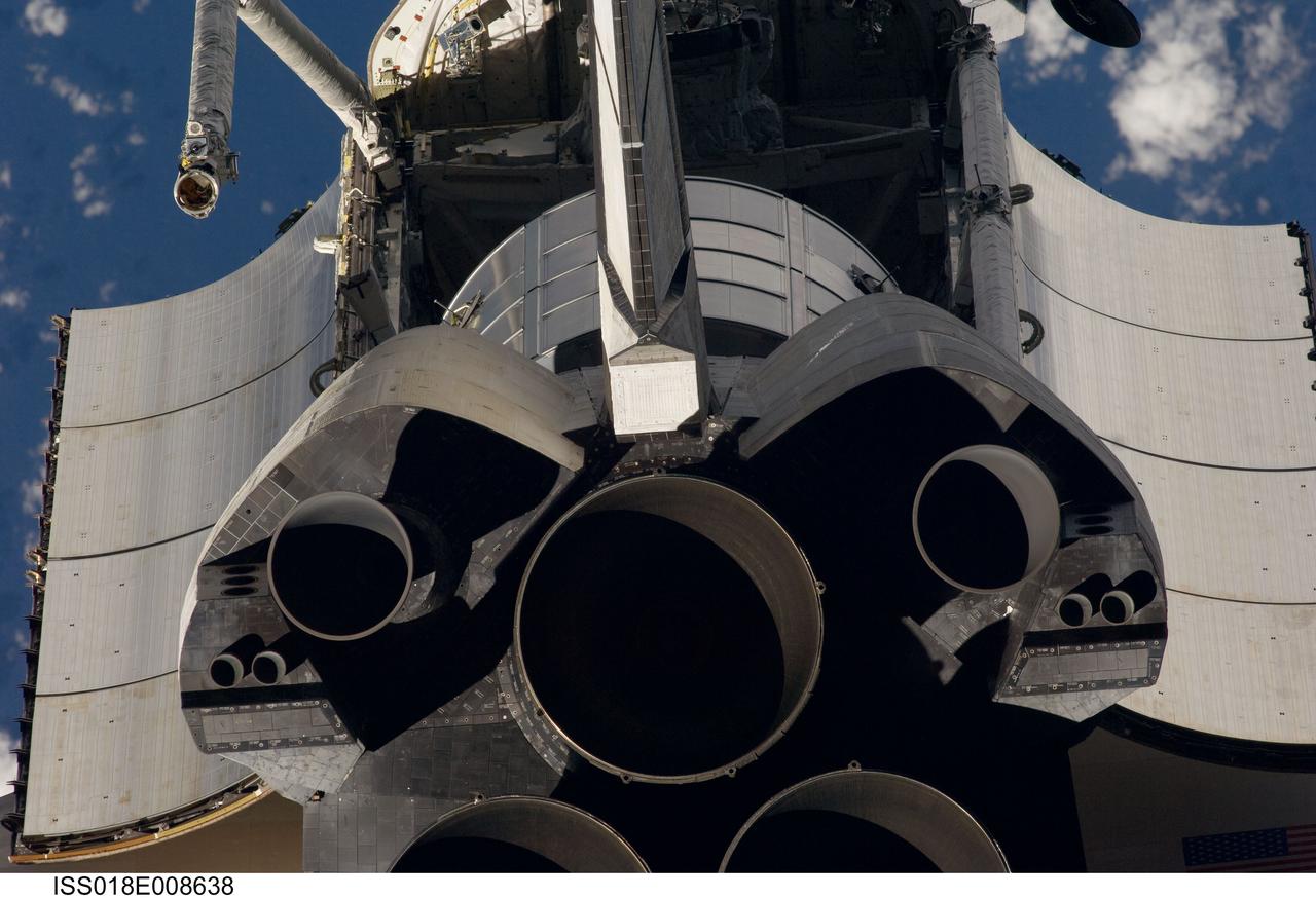 ISS018-E-008638 (16 Nov. 2008) --- A close-up view of Space Shuttle Endeavour's tail section was provided by Expedition 18 crewmembers on the International Space Station. The image provides partial views of the shuttle's main engines, orbital maneuvering system (OMS) pods, vertical stabilizer, the payload bay door panels and the Leonard Multi-Purpose Logistics Module located in the cargo bay. Before docking with the station, astronaut Chris Ferguson, STS-126 commander, flew the shuttle through a roll pitch maneuver or basically a backflip to allow the space station crew a good view of Endeavour's heat shield. Using digital still cameras equipped with both 400 and 800 millimeter lenses, the ISS crewmembers took a number of photos of the shuttle's thermal protection system and sent them down to teams on the ground for analysis. A 400 millimeter lens was used for this image.