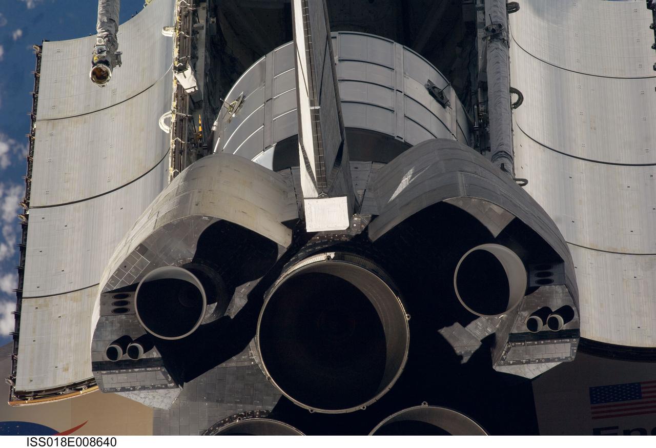 ISS018-E-008640 (16 Nov. 2008) --- A close-up view of Space Shuttle Endeavour's tail section was provided by Expedition 18 crewmembers on the International Space Station. The image provides partial views of the shuttle's main engines, orbital maneuvering system (OMS) pods, vertical stabilizer, the payload bay door panels and the Leonard Multi-Purpose Logistics Module located in the cargo bay. Before docking with the station, astronaut Chris Ferguson, STS-126 commander, flew the shuttle through a roll pitch maneuver or basically a backflip to allow the space station crew a good view of Endeavour's heat shield. Using digital still cameras equipped with both 400 and 800 millimeter lenses, the ISS crewmembers took a number of photos of the shuttle's thermal protection system and sent them down to teams on the ground for analysis. A 400 millimeter lens was used for this image.
