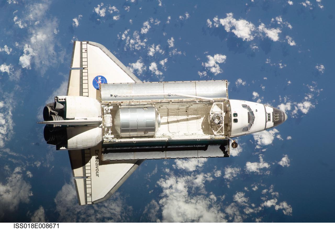 ISS018-E-008671 (16 Nov. 2008) --- Backdropped by a blue and white Earth, Space Shuttle Endeavour approaches the International Space Station during STS-126 rendezvous and docking operations. Docking occurred at 4:01 p.m. (CST) on Nov. 16, 2008. The Leonardo Multi-Purpose Logistics Module is visible in Endeavour's cargo bay with over 14,000 pounds of cargo for the space station.