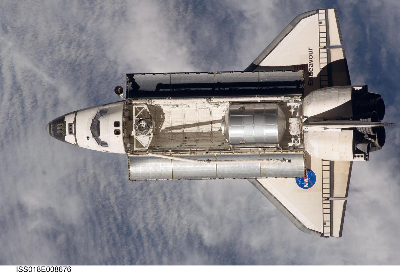 ISS018-E-008676 (16 Nov. 2008) --- Backdropped by a blue and white Earth, Space Shuttle Endeavour approaches the International Space Station during STS-126 rendezvous and docking operations. Docking occurred at 4:01 p.m. (CST) on Nov. 16, 2008. The Leonardo Multi-Purpose Logistics Module is visible in Endeavour's cargo bay with over 14,000 pounds of cargo for the space station.