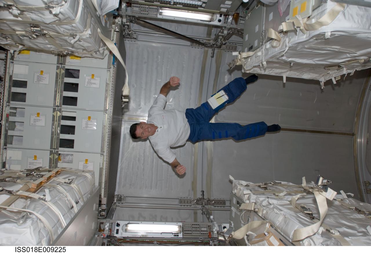 ISS018-E-009225 (18 Nov. 2008) --- Astronaut Shane Kimbrough, STS-126 mission specialist, floats in the Leonardo Multi-Purpose Logistics Module attached to the Earth-facing port of the International Space Station's Harmony node while Space Shuttle Endeavour is docked with the station.