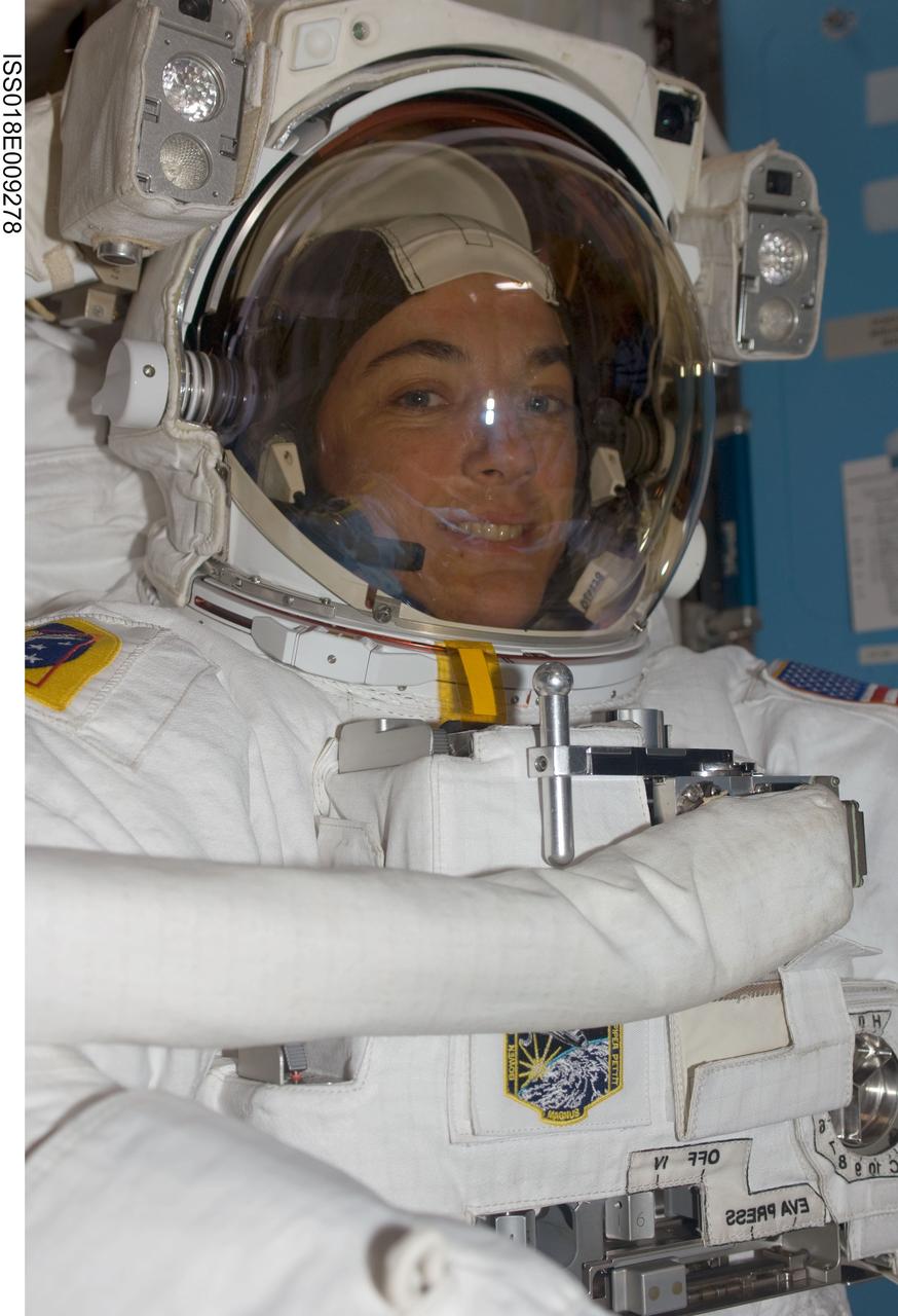 ISS018-E-009278 (18 Nov. 2008) --- Astronaut Heidemarie Stefanyshyn-Piper, STS-126 mission specialist, attired in her Extravehicular Mobility Unit (EMU) spacesuit, awaits the start of the mission's first scheduled session of extravehicular activity (EVA) in the Quest Airlock of the International Space Station.