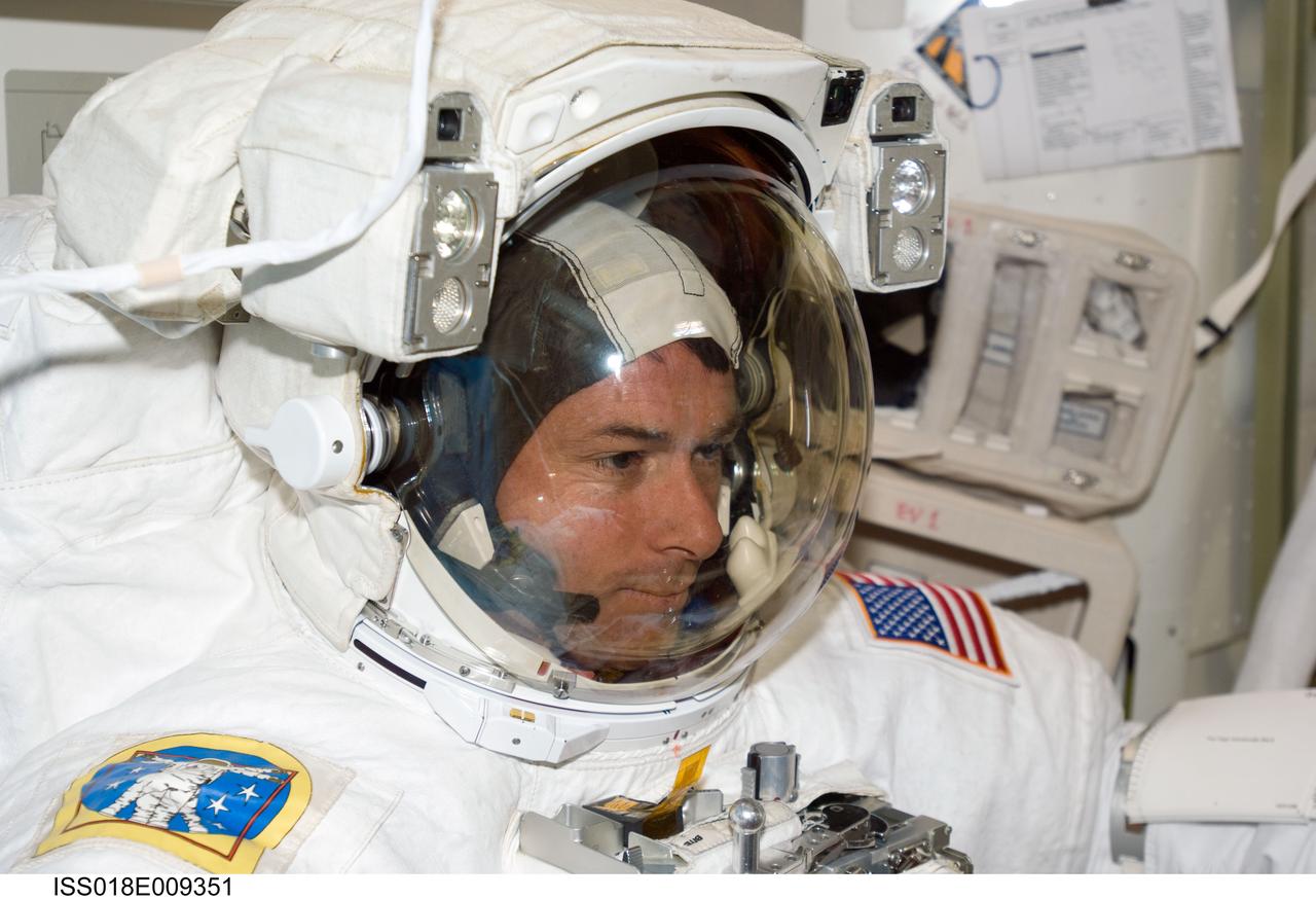 ISS018-E-009351 (20 Nov. 2008) --- Astronaut Shane Kimbrough, STS-126 mission specialist, attired in his Extravehicular Mobility Unit (EMU) spacesuit, awaits the start of the mission's second scheduled session of extravehicular activity (EVA) in the Quest Airlock of the International Space Station.