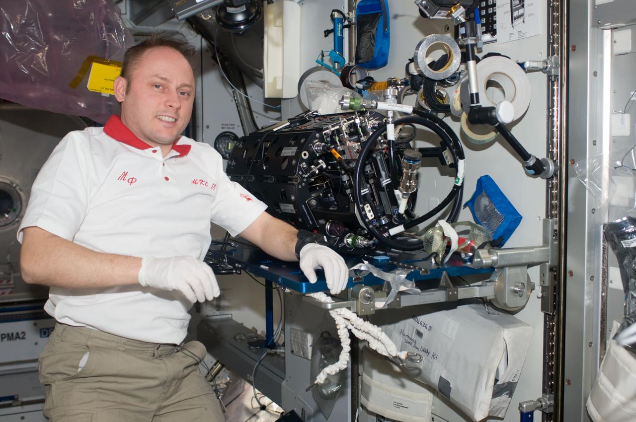 ISS018-E-010645 (6 Dec. 2008) --- Astronaut Michael Fincke, Expedition 18 commander, works on the Multi-User Droplet Combustion Apparatus (MDCA) Chamber Insert Assembly (CIA) in the Harmony node of the International Space Station.