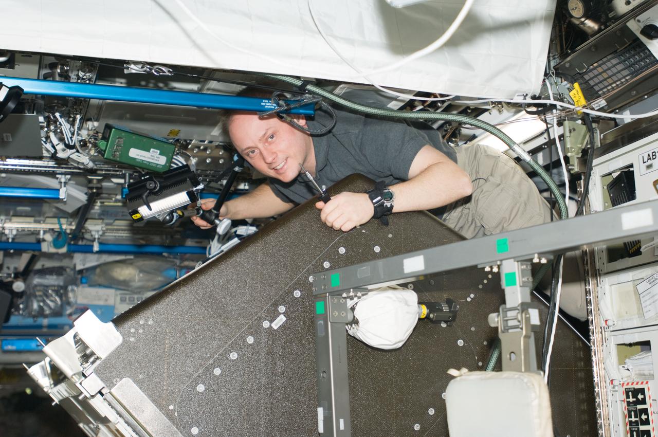 ISS018-E-011530 (8 Dec. 2008) --- Astronaut Michael Fincke, Expedition 18 commander, performs a leak check on the Water Recovery System (WRS) in the Destiny laboratory of the International Space Station.