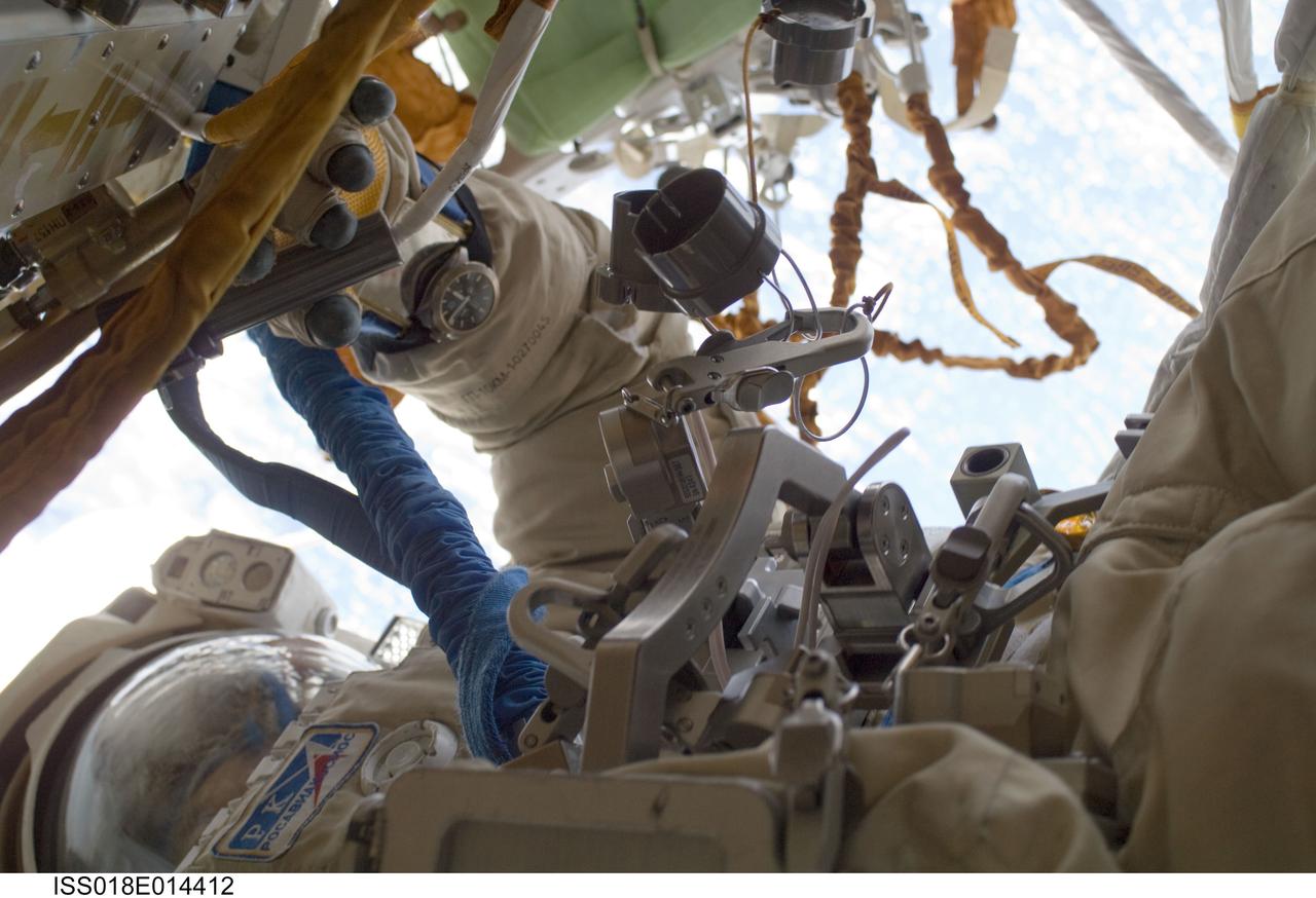 ISS018-E-014412 (23 Dec. 2008) --- Cosmonaut Yury Lonchakov, Expedition 18 flight engineer, performs a task during the Dec. 23 spacewalk on the International Space Station.
