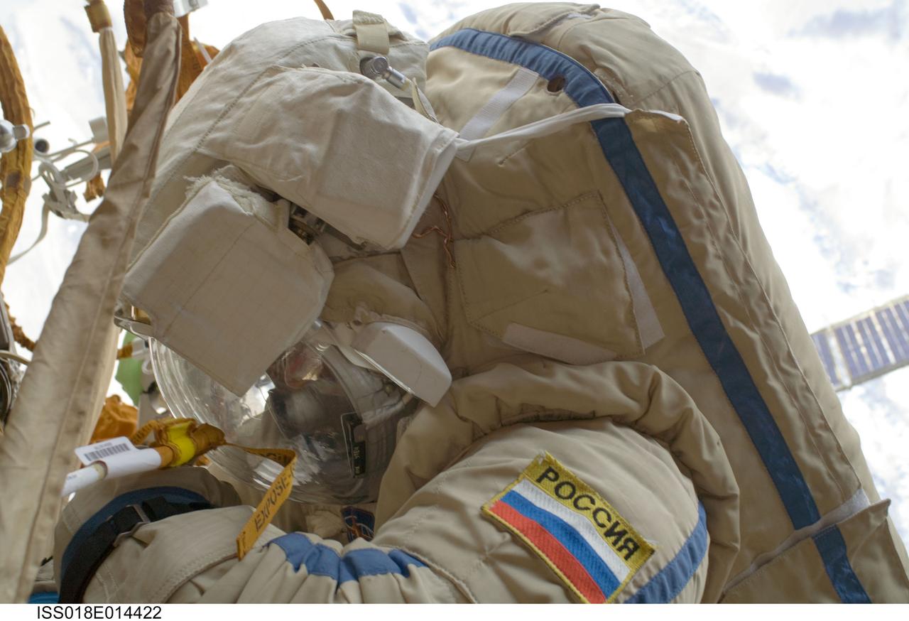 ISS018-E-014422 (23 Dec. 2008) --- Cosmonaut Yury Lonchakov, Expedition 18 flight engineer, performs a task during the Dec. 23 spacewalk on the International Space Station.