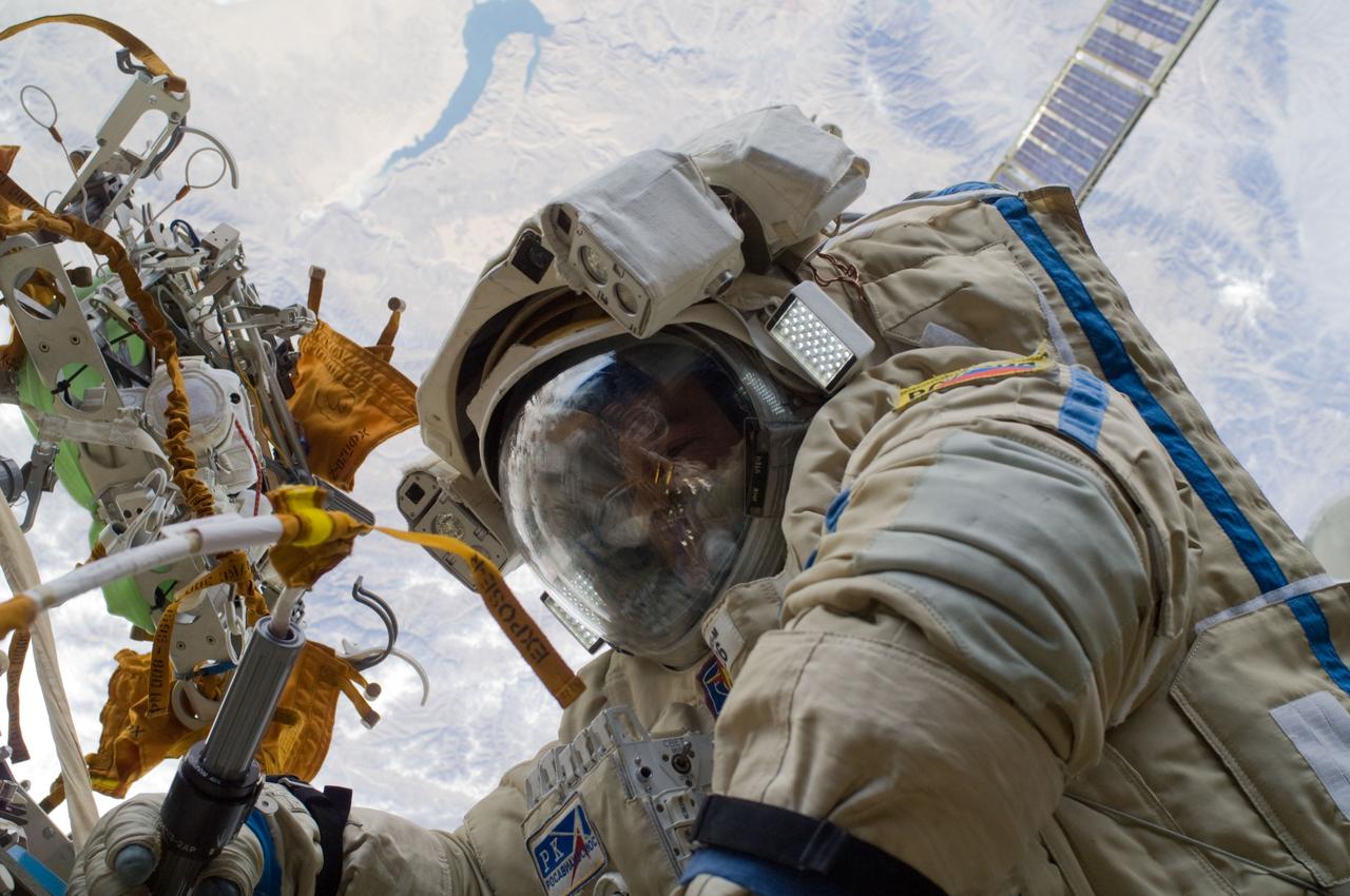 ISS018-E-014431 (23 Dec. 2008) --- Cosmonaut Yury Lonchakov, Expedition 18 flight engineer, performs a task during the Dec. 23 spacewalk on the International Space Station.