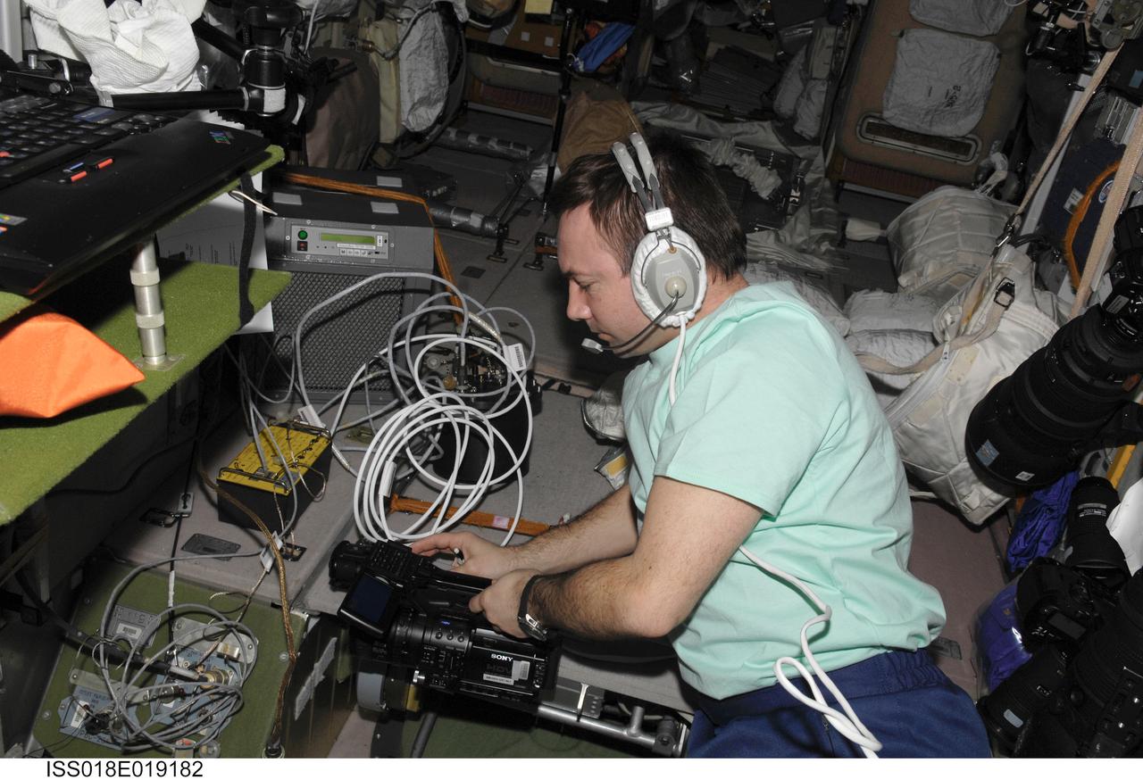 ISS018-E-019182 (13 Jan. 2009) --- Cosmonaut Yury Lonchakov, Expedition 18 flight engineer, uses a communication system while working in the Zvezda Service Module of the International Space Station.