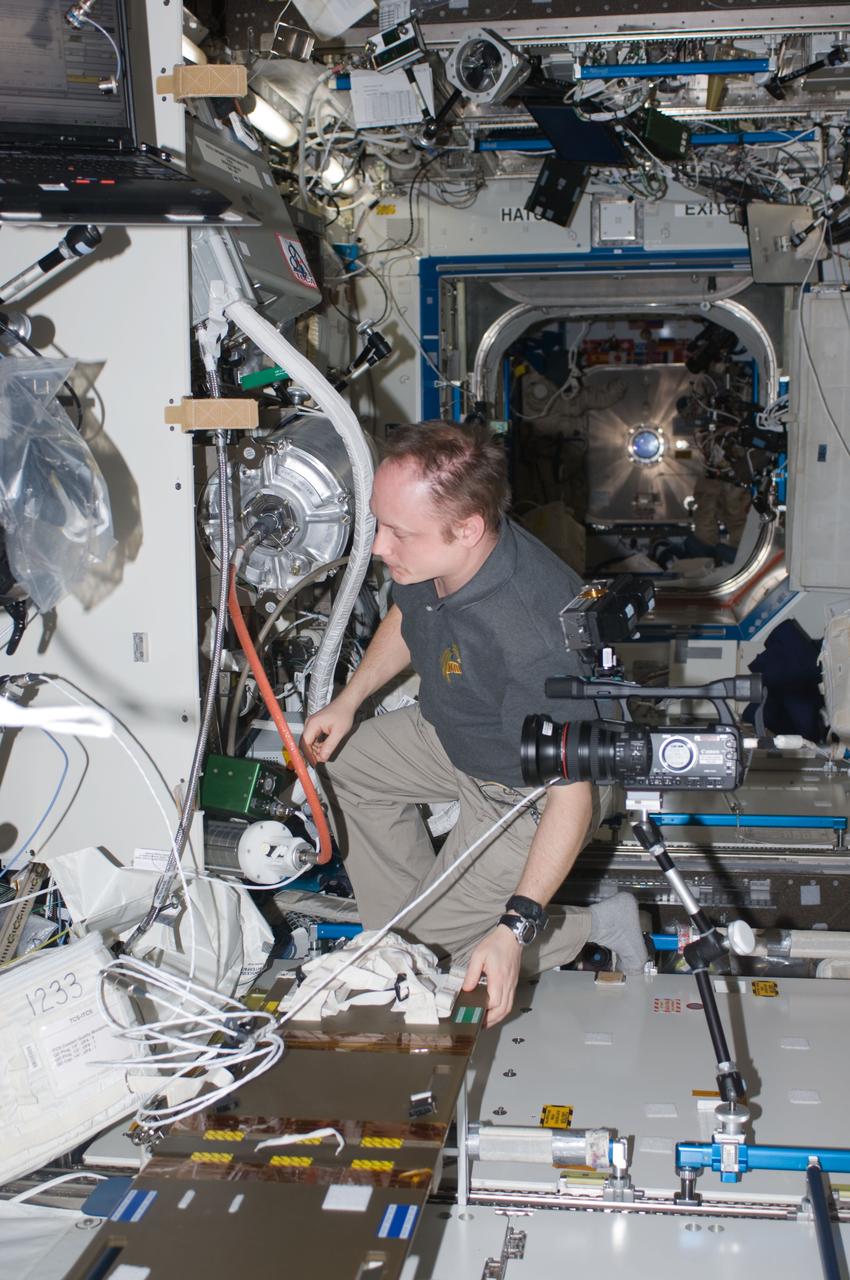 ISS018-E-019723 (9 Jan. 2009) --- Astronaut Michael Fincke, Expedition 18 commander, works on hardware in the Destiny laboratory of the International Space Station.