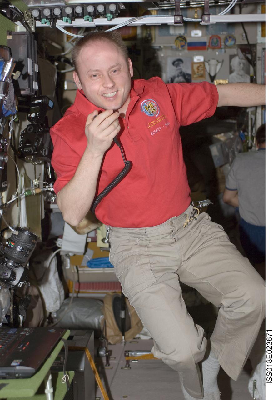 ISS018-E-023671 (27 Jan. 2009) --- Astronaut Michael Fincke, Expedition 18 commander, uses a ham radio system in the Zvezda Service Module of the International Space Station.