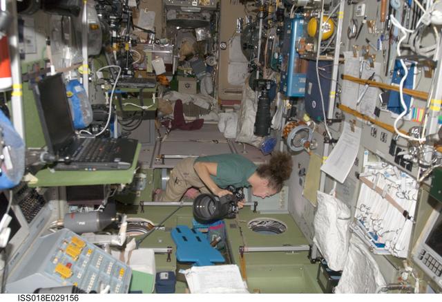 NASA image: ISS Expedition 18 Sandra Magnus in Service Module (SM) with cameras