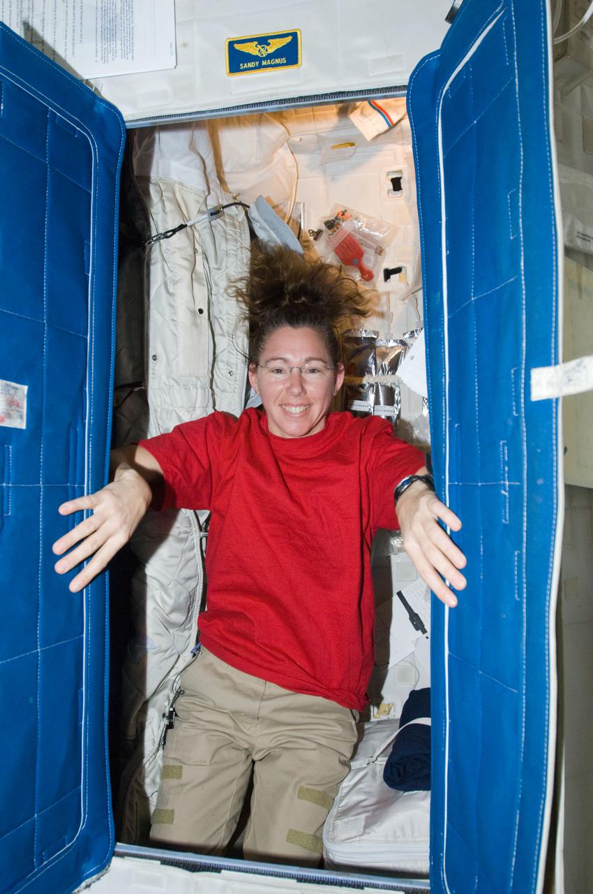 ISS018-E-029186 (9 Feb. 2009) --- Astronaut Sandra Magnus, Expedition 18 flight engineer, poses for a photo in her crew compartment in the Destiny laboratory of the International Space Station.