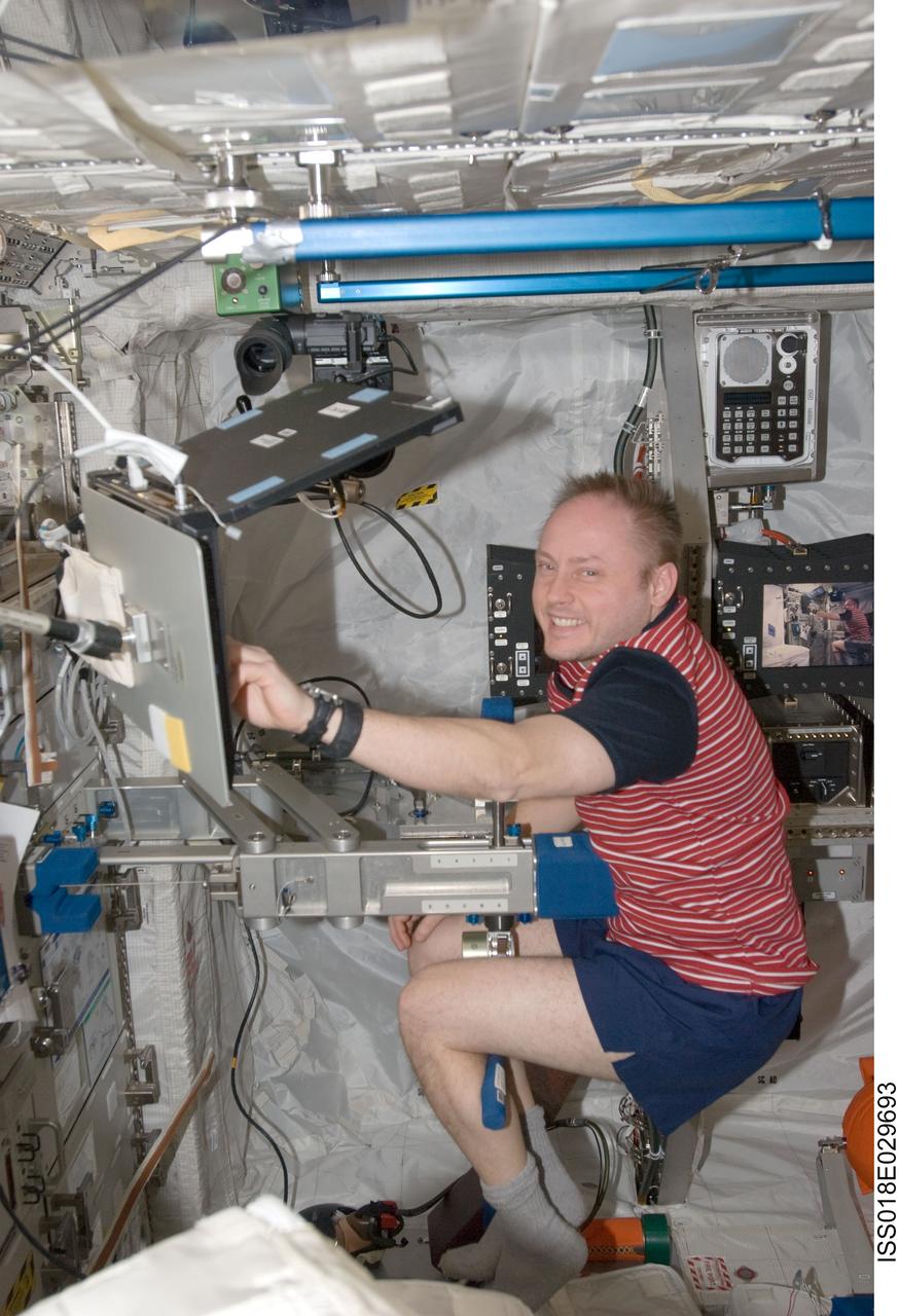 ISS018-E-029693 (10 Feb. 2009) --- Astronaut Michael Fincke, Expedition 18 commander, uses a computer at a work station in the Columbus laboratory of the International Space Station.