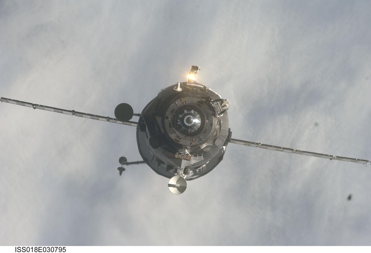 ISS018-E-030795 (13 Feb. 2009) --- Backdropped by a blanket of clouds, an unpiloted Progress supply vehicle approaches the International Space Station, bringing more than two tons of food, fuel and other supplies to the Expedition 18 crewmembers aboard the station. Progress 32 docked to the Pirs Docking Compartment at 1:18 a.m. (CST) on Feb. 13, 2009, after a three day flight from the Baikonur Cosmodrome in Kazakhstan.
