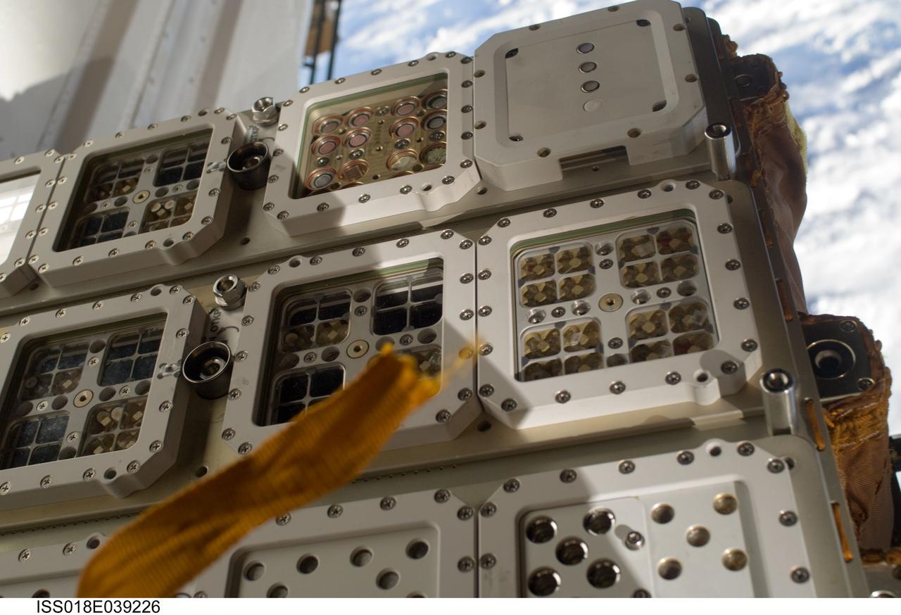 ISS018-E-039226 (10 March 2009) --- One of two Expedition 18 spacewalkers on March 10 provided this close-up image of the Expose-R experiment, reinstalled a short while earlier on the outside of the Russian segment of the International Space Station.  The European experiment is equipped with three trays which contain a variety of biological samples.