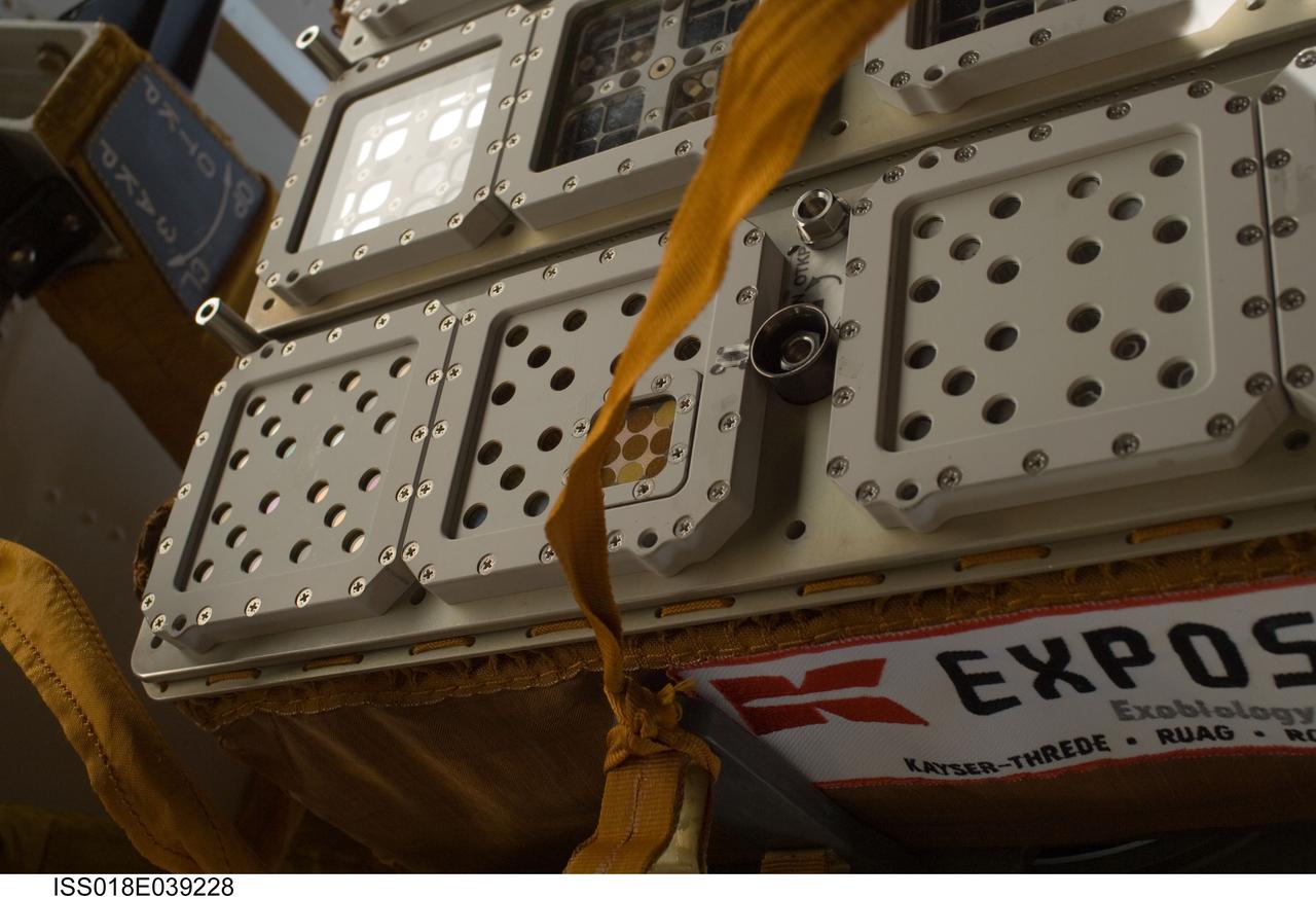 ISS018-E-039228 (10 March 2009) --- One of two Expedition 18 spacewalkers on March 10 provided this close-up image of the Expose-R experiment,  reinstalled a short while earlier on the outside of the Russian segment of the International Space Station.  The European experiment is equipped with three trays which contain a variety of biological samples.