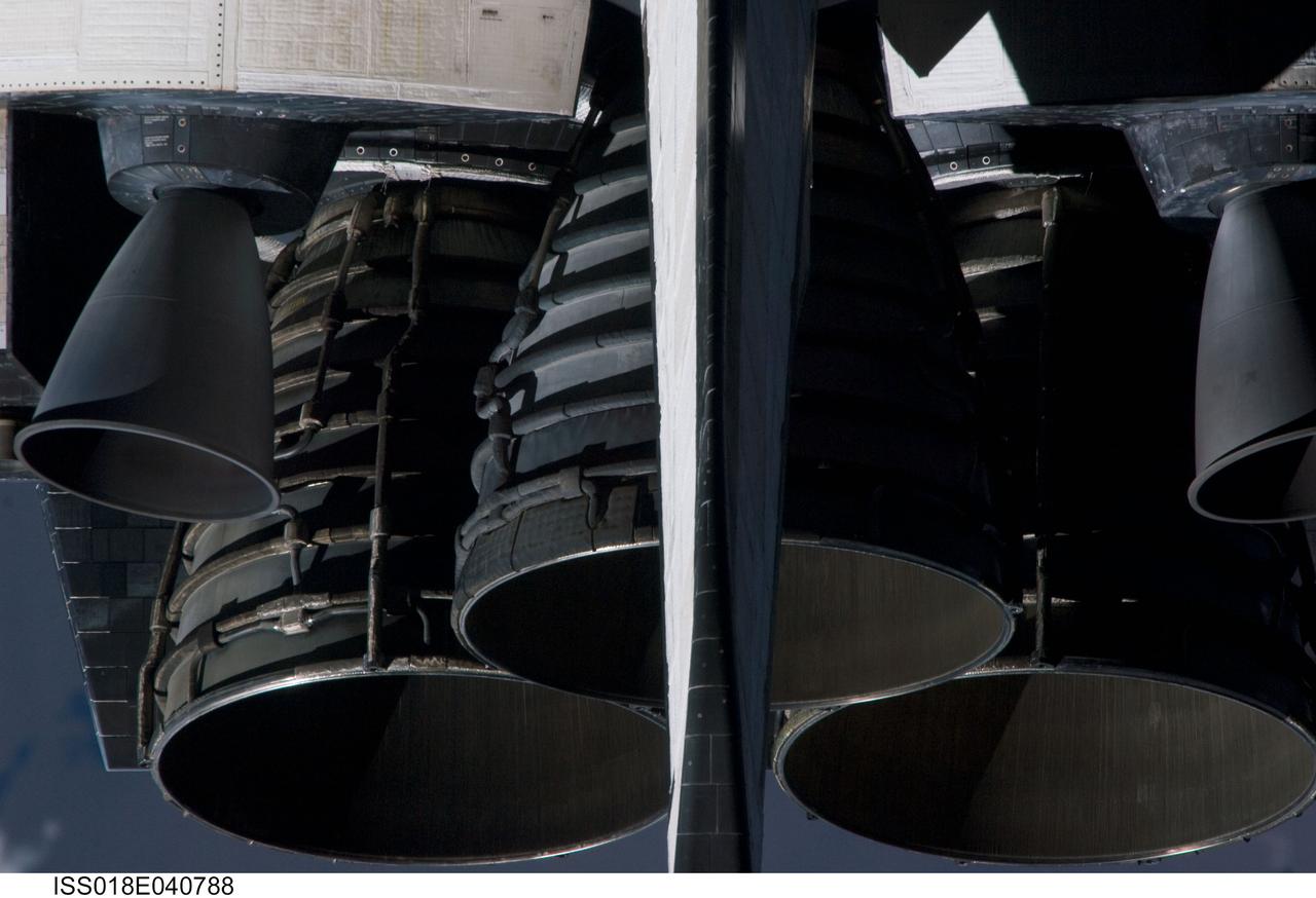 ISS018-E-040788 (17 March 2009) --- A close-up view of Space Shuttle Discovery?s main engines was provided by Expedition 18 crewmembers on the International Space Station. Before docking with the station, astronaut Lee Archambault, STS-119 commander, flew the shuttle through a Rendezvous Pitch Maneuver or basically a backflip to allow the space station crew a good view of Discovery's heat shield. Using digital still cameras equipped with both 400 and 800 millimeter lenses, the ISS crewmembers took a number of photos of the shuttle's thermal protection system and sent them down to teams on the ground for analysis. A 800 millimeter lens was used for this image.