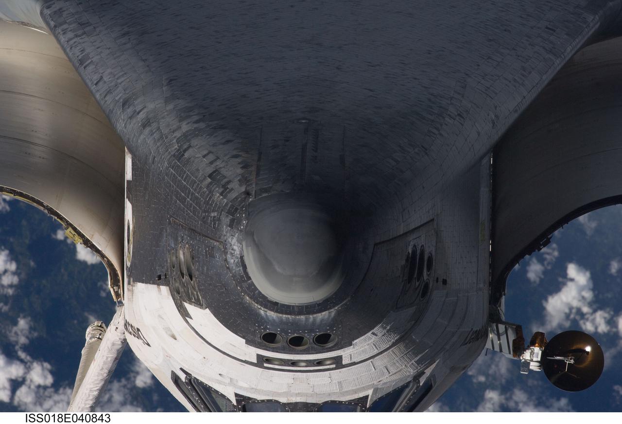 ISS018-E-040843 (17 March 2009) --- A close-up view of the exterior of Space Shuttle Discovery's nose and underside was provided by Expedition 18 crewmembers on the International Space Station. Before docking with the station, astronaut Lee Archambault, STS-119 commander, flew the shuttle through a Rendezvous Pitch Maneuver or basically a backflip to allow the space station crew a good view of Discovery's heat shield. Using digital still cameras equipped with both 400 and 800 millimeter lenses, the ISS crewmembers took a number of photos of the shuttle's thermal protection system and sent them down to teams on the ground for analysis. A 400 millimeter lens was used for this image.