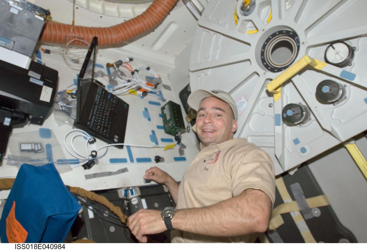 ISS018-E-040984 (18 March 2009) --- Astronaut Lee Archambault, STS-119 commander, is pictured on the middeck of Space Shuttle Discovery while docked with the International Space Station.