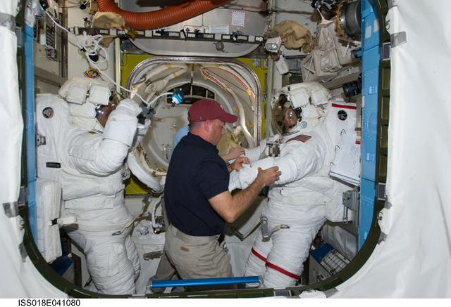 NASA image: Extravehicular Activity (EVA) 1 Extravehicular Mobility Unit (EMU) Suit Preparations in Joint Airlock Quest