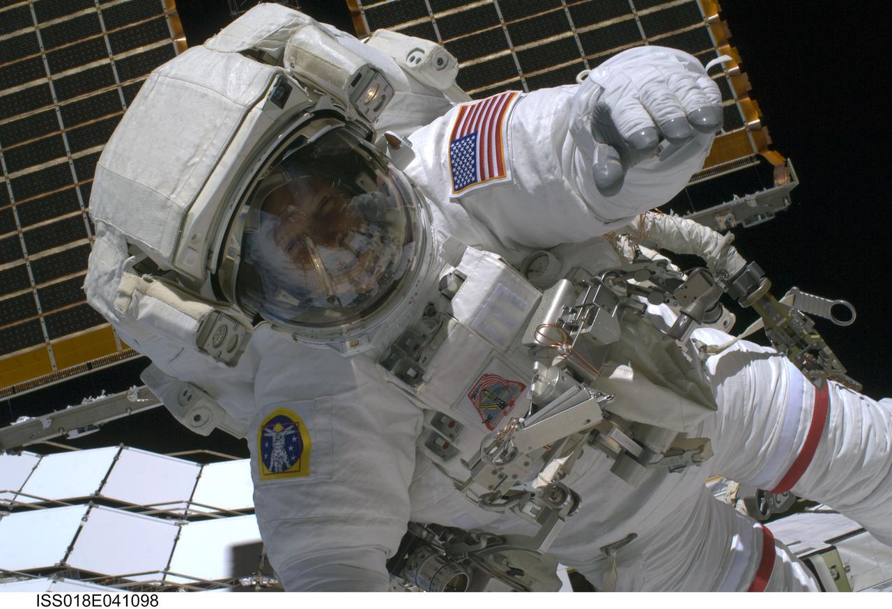 ISS018-E-041098 (19 March 2009) --- Astronaut Steve Swanson, STS-119 mission specialist, participates in the mission's first scheduled session of extravehicular activity (EVA) as construction and maintenance continue on the International Space Station. During the six-hour, seven-minute spacewalk, Swanson and astronaut Richard Arnold (out of frame), mission specialist, connected bolts to permanently attach the S6 truss segment to S5. The spacewalkers plugged in power and data connectors to the truss, prepared a radiator to cool it, opened boxes containing the new solar arrays and deployed the Beta Gimbal Assemblies containing masts that support the solar arrays.