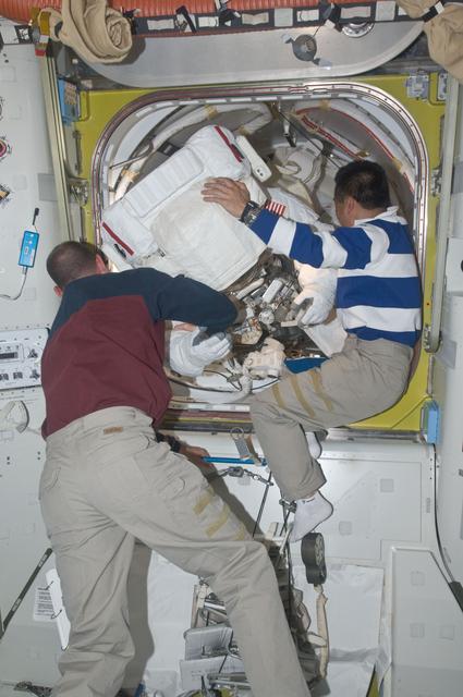 NASA image: STS-119 Extravehicular Activity (EVA) 2 Extravehicular Mobility Unit (EMU) Doff