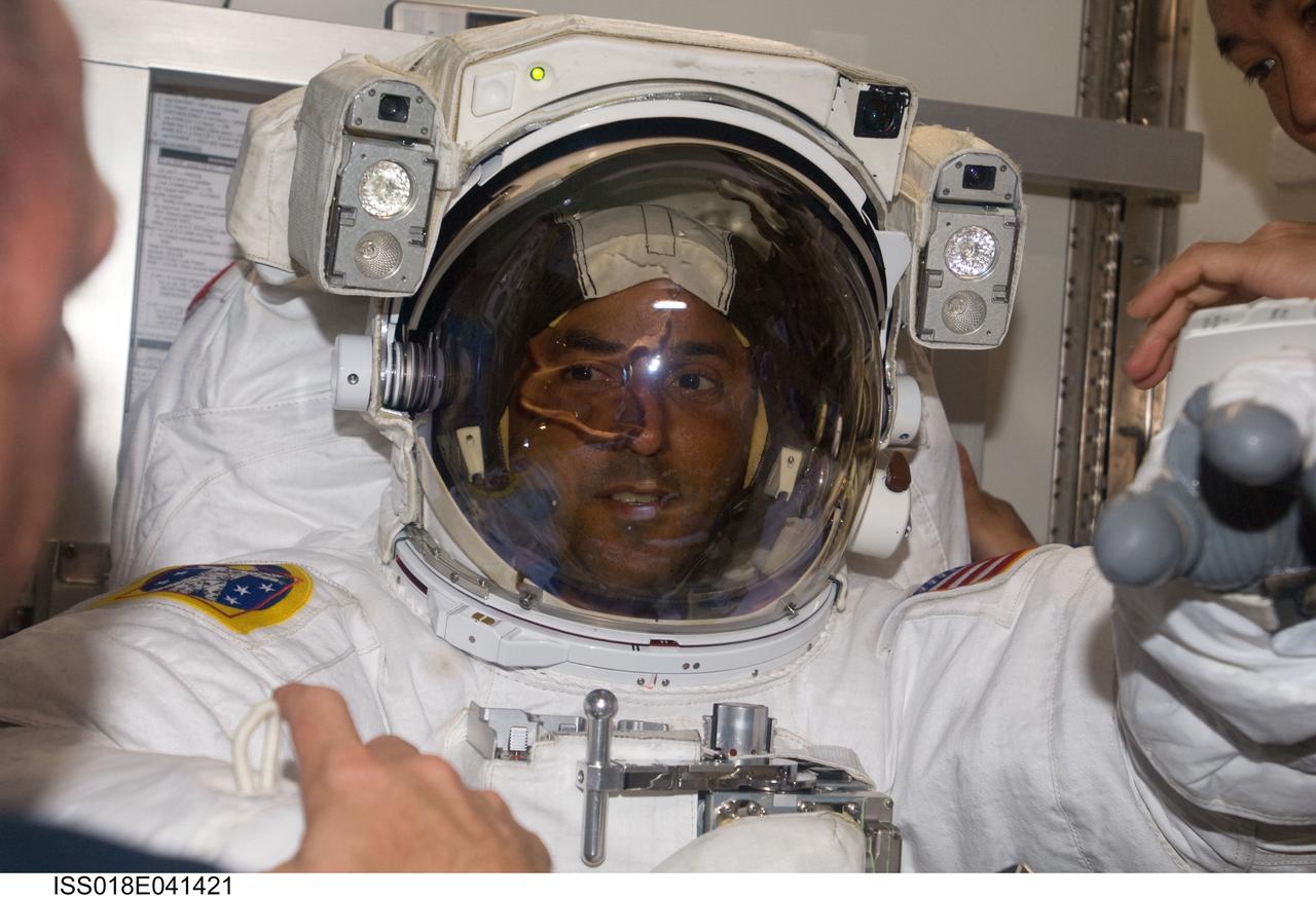 ISS018-E-041421 (21 March 2009) --- Astronaut Joseph Acaba, STS-119 mission specialist, attired in his Extravehicular Mobility Unit (EMU) spacesuit, is pictured in the Quest Airlock of the International Space Station as the mission?s second session of extravehicular activity (EVA) draws to a close.
