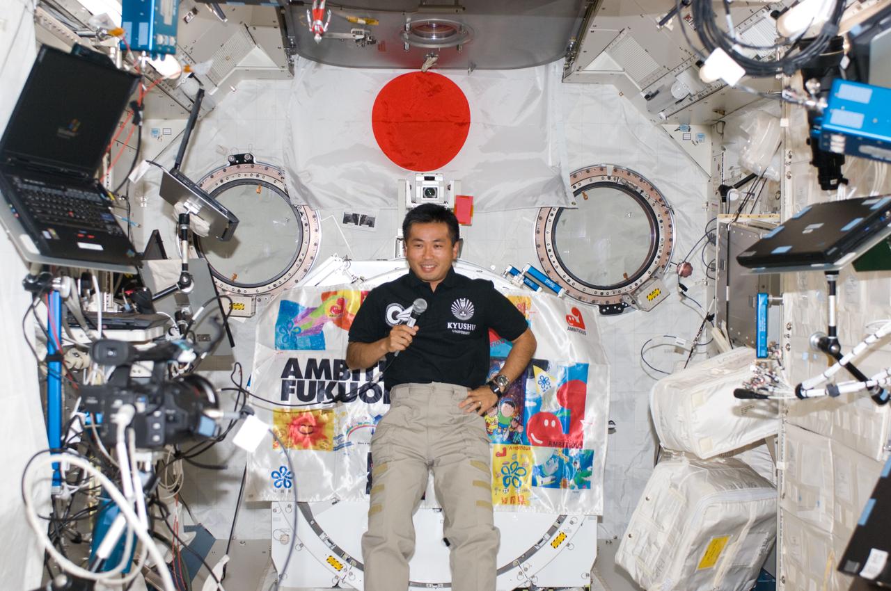 ISS018-E-043487 (25 March 2009) --- Japan Aerospace Exploration Agency (JAXA) astronaut Koichi Wakata, Expedition 18 flight engineer, uses a communication system during a press conference in the Kibo laboratory of the International Space Station.