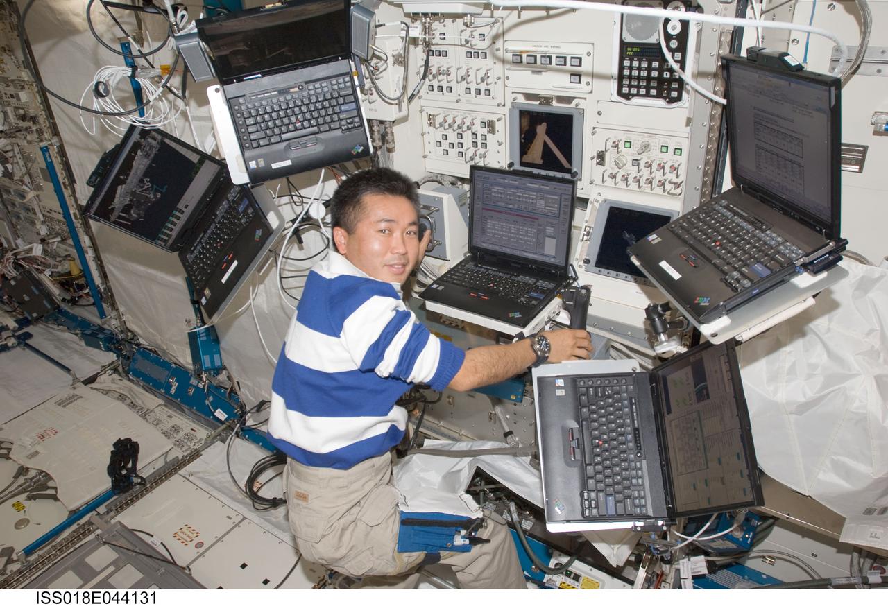 ISS018-E-044131 (31 March 2009) --- Japan Aerospace Exploration Agency (JAXA) astronaut Koichi Wakata, Expedition 18/19 flight engineer, uses a computer at the Japanese Remote Manipulator System (JEM-RMS) work station in the Kibo laboratory of the International Space Station.
