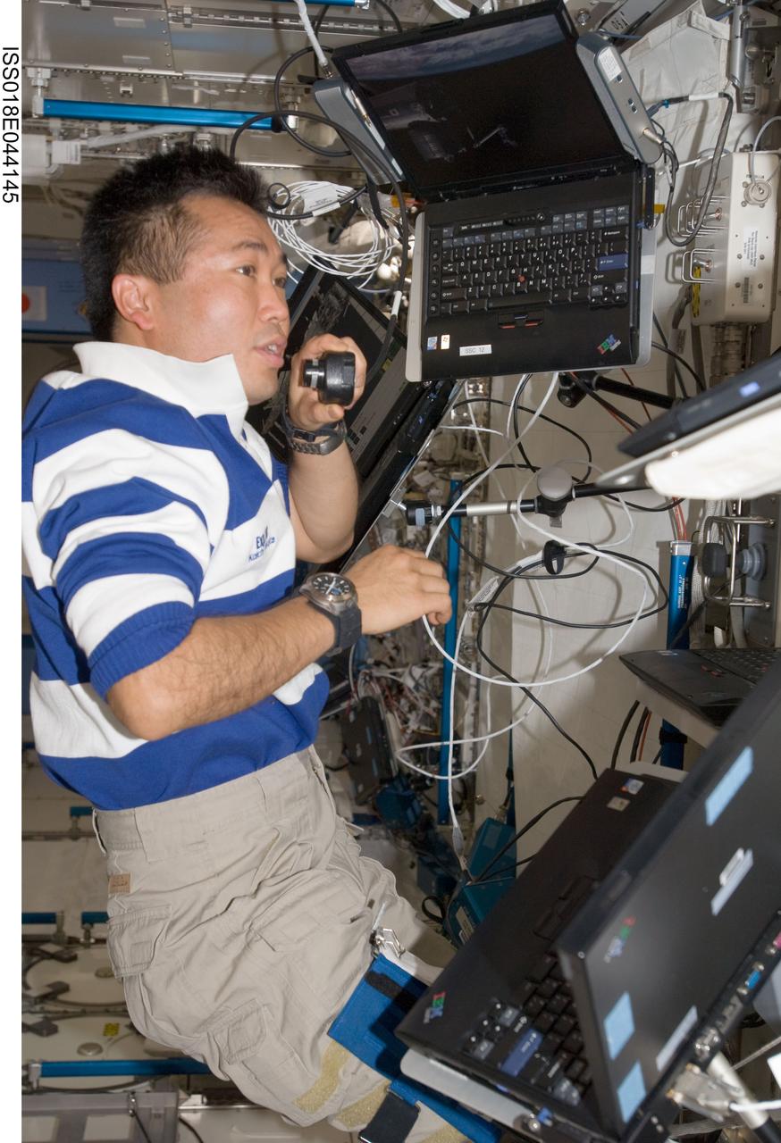 ISS018-E-044145 (31 March 2009) --- Japan Aerospace Exploration Agency (JAXA) astronaut Koichi Wakata, Expedition 18/19 flight engineer, uses a communication system at the Japanese Remote Manipulator System (JEM-RMS) work station in the Kibo laboratory of the International Space Station.