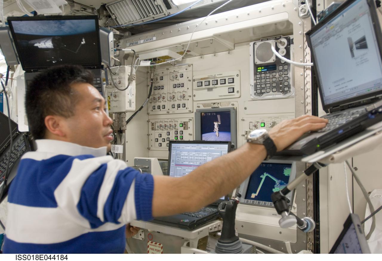 ISS018-E-044184 (31 March 2009) --- Japan Aerospace Exploration Agency (JAXA) astronaut Koichi Wakata, Expedition 18/19 flight engineer, uses a computer at the Japanese Remote Manipulator System (JEM-RMS) work station in the Kibo laboratory of the International Space Station.