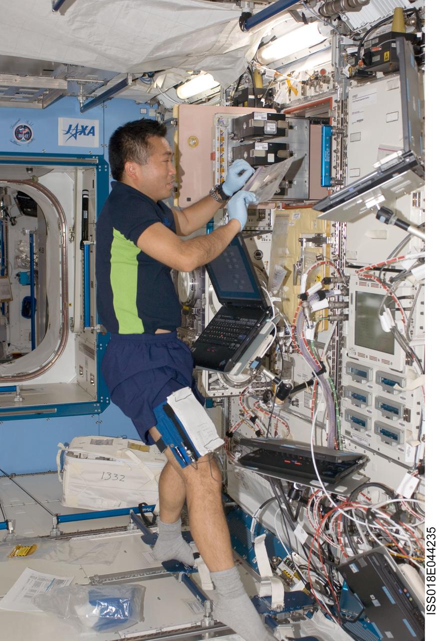 ISS018-E-044235 (28 March 2009) --- Japan Aerospace Exploration Agency (JAXA) astronaut Koichi Wakata, Expedition 18/19 flight engineer, works on an experiment at the Ryutai fluid science experiment rack in the Kibo laboratory of the International Space Station.