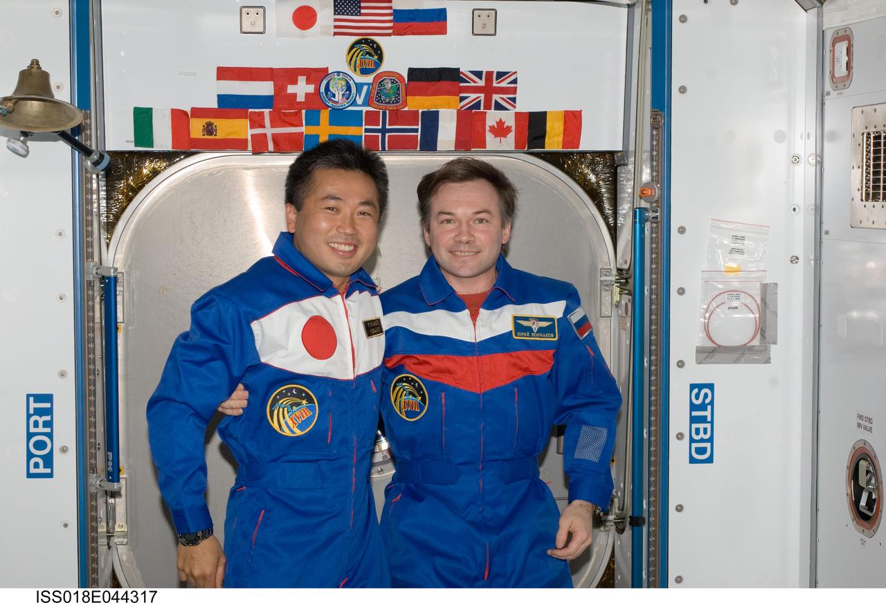 ISS018-E-044317 (1 April 2009) --- Japan Aerospace Exploration Agency (JAXA) astronaut Koichi Wakata (left), Expedition 18/19 flight engineer; and cosmonaut Yury Lonchakov, Expedition 18 flight engineer, pose for a photo in the Harmony node of the International Space Station.