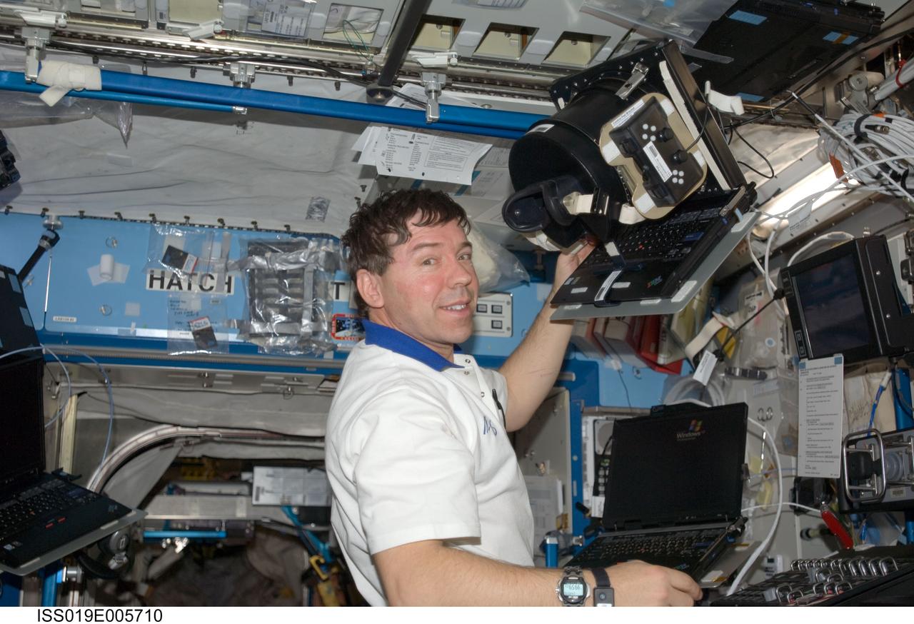 ISS019-E-005710 (9 April 2009) --- Astronaut Michael Barratt, Expedition 19/20 flight engineer, uses Neurospat hardware to perform the Bodies in the Space Environment (BISE) experiment in the Destiny laboratory of the International Space Station. The Canadian Space Agency-sponsored BISE experiment studies how astronauts perceive up and down in microgravity.