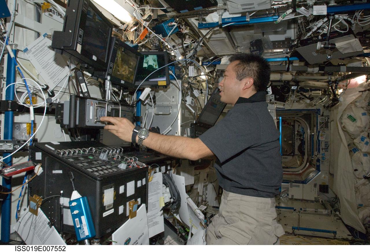 ISS019-E-007552 (17 April 2009) --- Japan Aerospace Exploration Agency (JAXA) astronaut Koichi Wakata, Expedition 19/20 flight engineer, works the controls at the Canadarm2 robotic work station in the Destiny laboratory of the International Space Station.