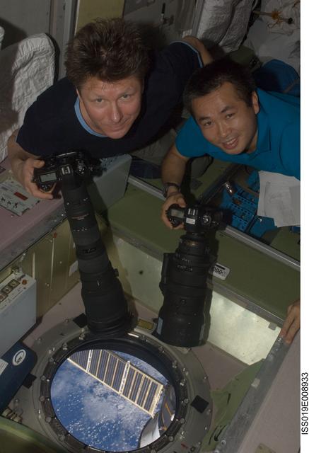 NASA image: Padalka and Wakata with cameras at SM window