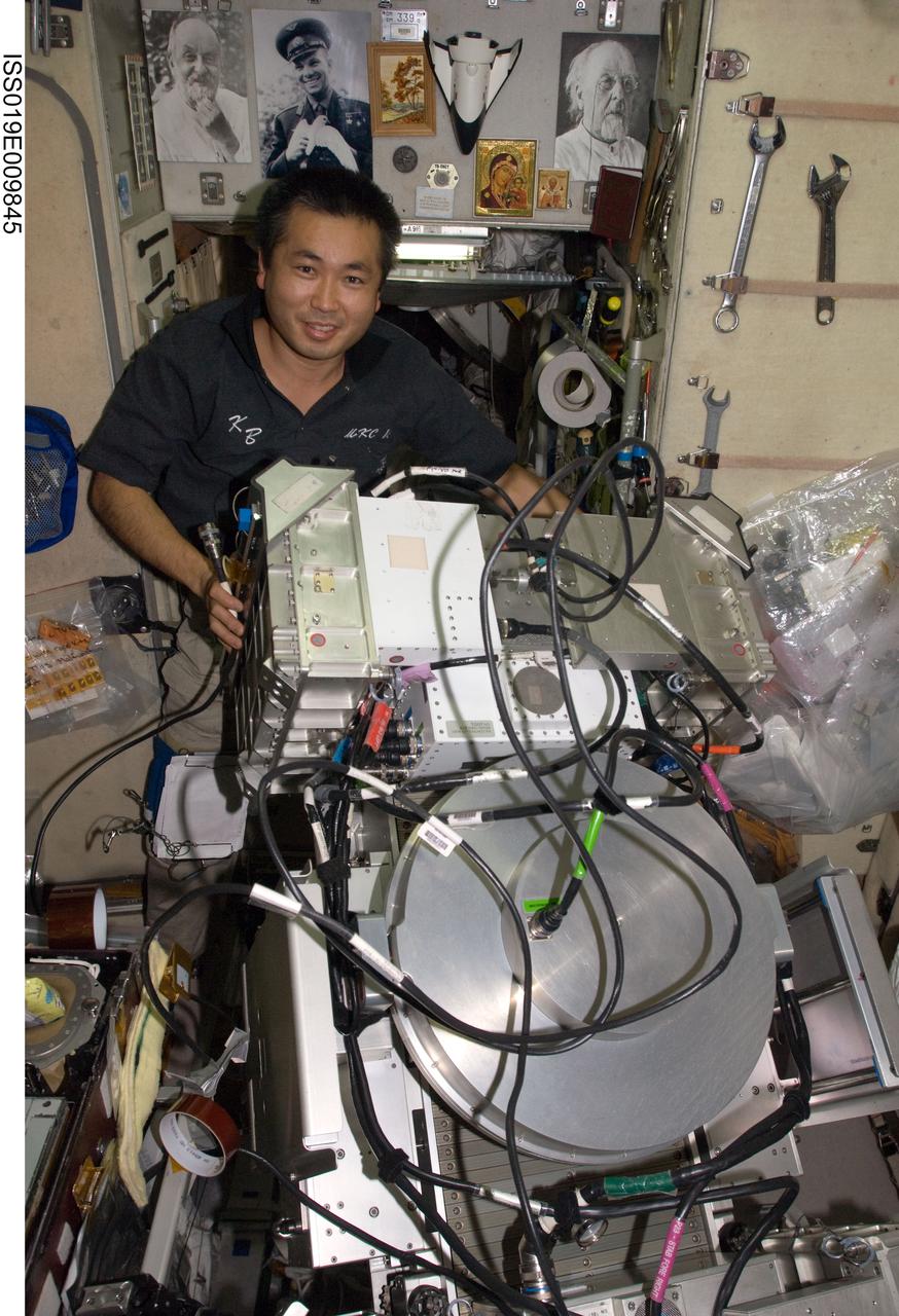 ISS019-E-009845 (23 April 2009) --- Japan Aerospace Exploration Agency (JAXA) astronaut Koichi Wakata, Expedition 19/20 flight engineer, performs in-flight maintenance on the Treadmill Vibration Isolation System (TVIS) in the Zvezda Service Module of the International Space Station.