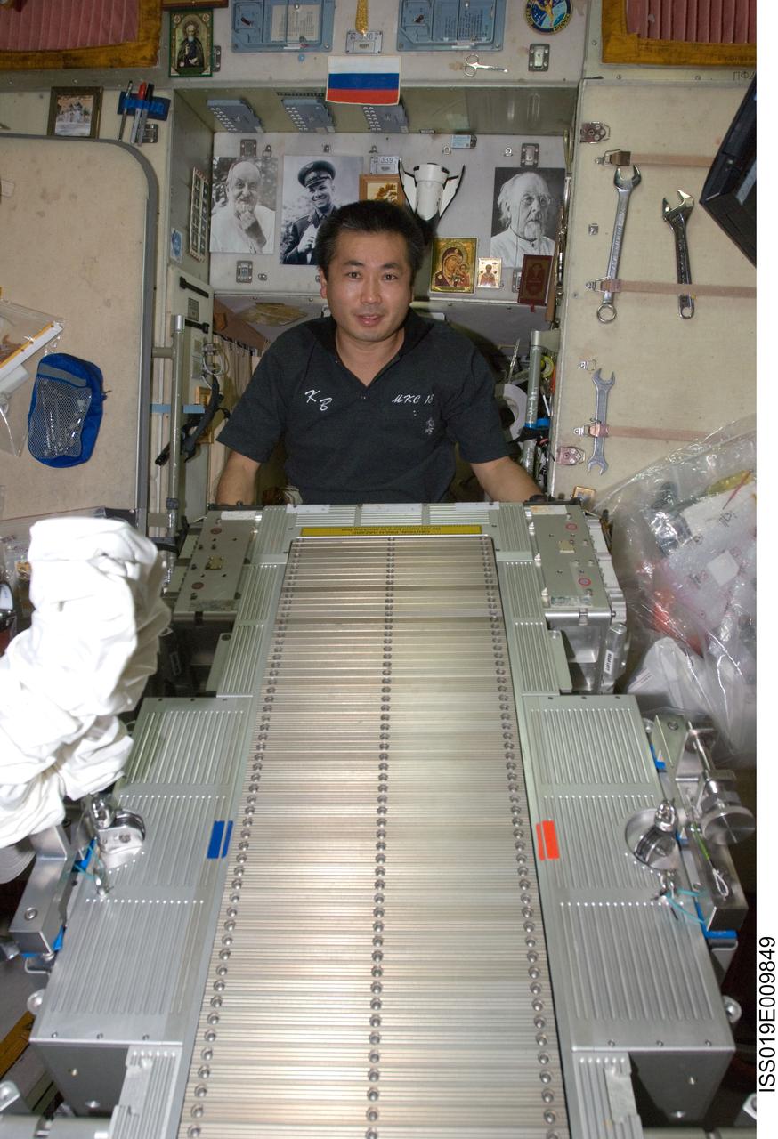 ISS019-E-009849 (23 April 2009) --- Japan Aerospace Exploration Agency (JAXA) astronaut Koichi Wakata, Expedition 19/20 flight engineer, performs in-flight maintenance on the Treadmill Vibration Isolation System (TVIS) in the Zvezda Service Module of the International Space Station.