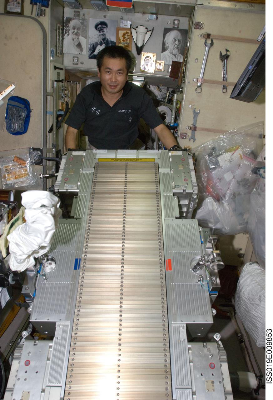 ISS019-E-009853 (23 April 2009) --- Japan Aerospace Exploration Agency (JAXA) astronaut Koichi Wakata, Expedition 19/20 flight engineer, performs in-flight maintenance on the Treadmill Vibration Isolation System (TVIS) in the Zvezda Service Module of the International Space Station.