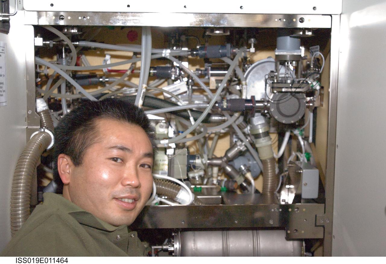 ISS019-E-011464 (28 April 2009) --- Japan Aerospace Exploration Agency (JAXA) astronaut Koichi Wakata, Expedition 19/20 flight engineer, performs in-flight maintenance on the waste and hygiene compartment located in the Destiny laboratory of the International Space Station.