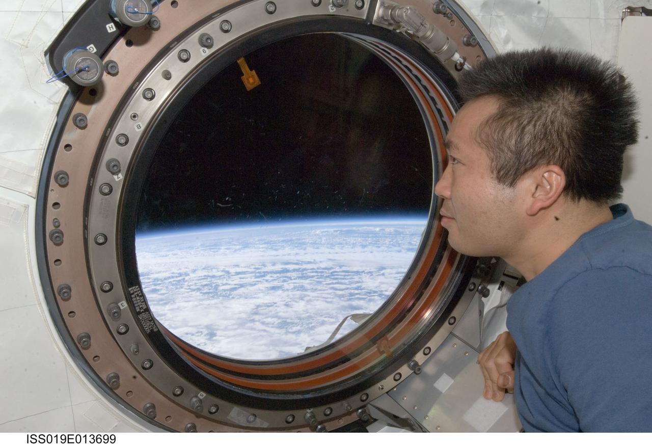 ISS019-E-013699 (3 May 2009) --- Japan Aerospace Exploration Agency (JAXA) astronaut Koichi Wakata, Expedition 19/20 flight engineer, looks through a window in the Kibo laboratory of the International Space Station.