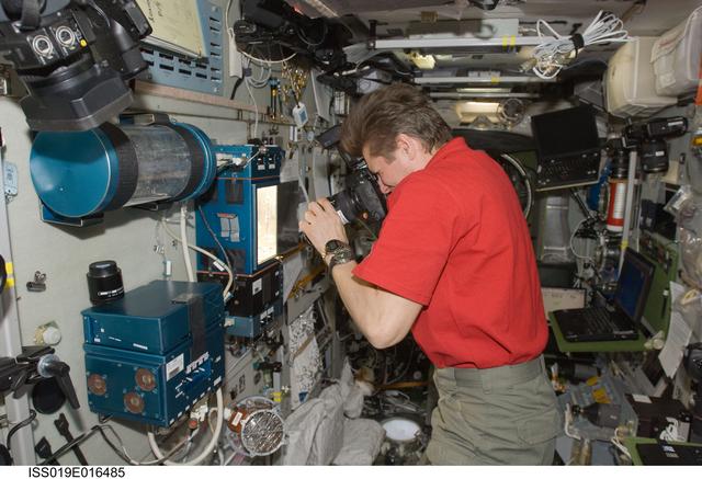 NASA image: Padalka photographs plants in LADA-14  greenhouse