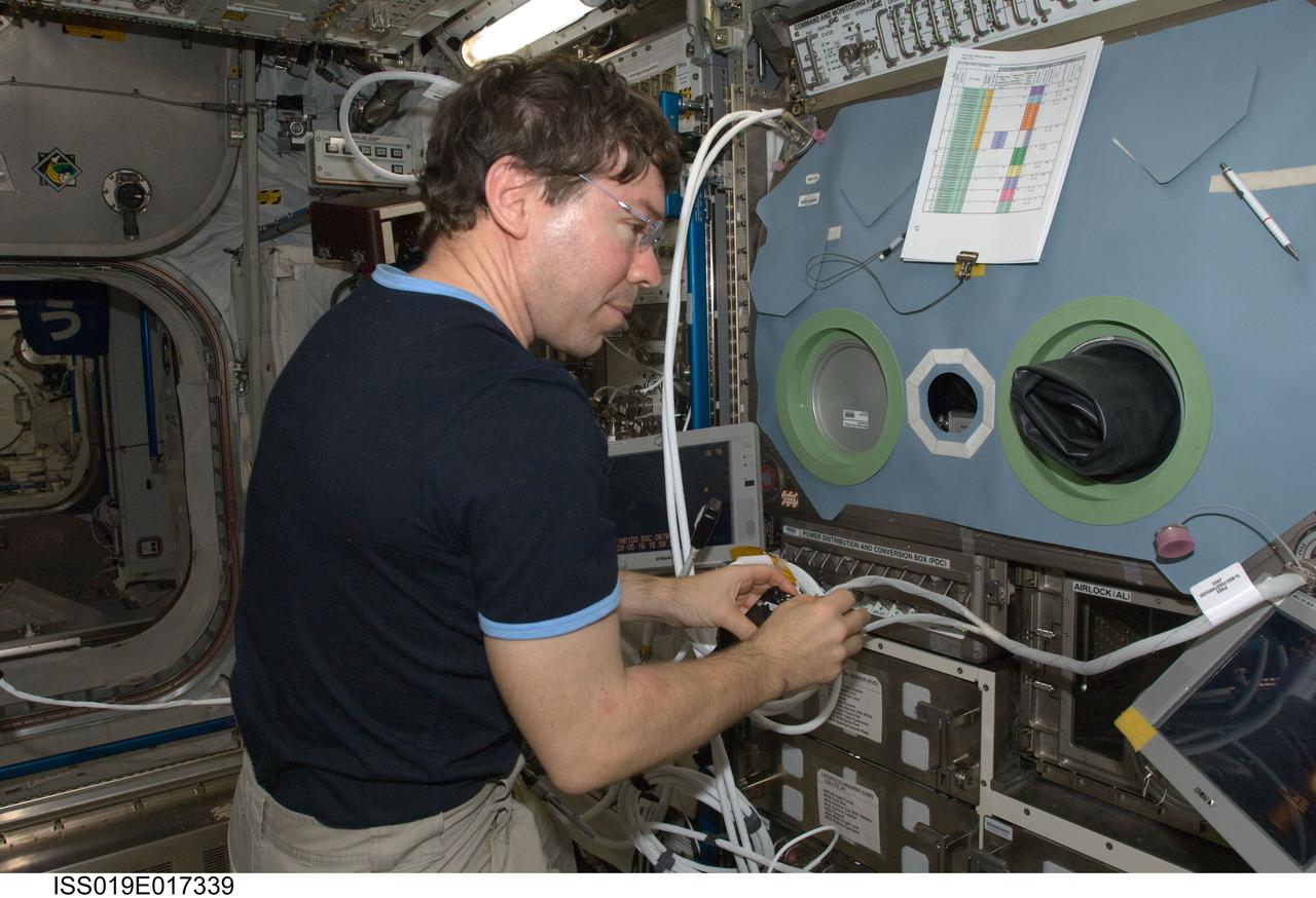 ISS019-E-017339 (16 May 2009) --- Astronaut Michael Barratt, Expedition 19/20 flight engineer, works with the Microgravity Science Glovebox (MSG) in the Columbus laboratory of the International Space Station.
